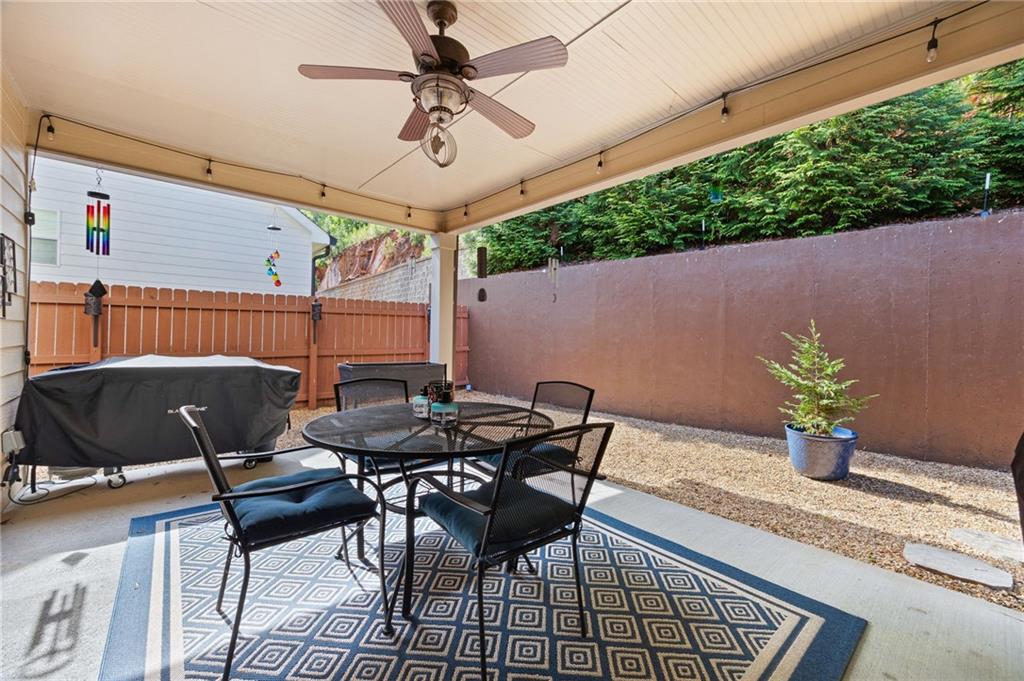 102 Kirk Drive Dallas, GA 30132 - Photo 24 of 28 a patio with table and chairs