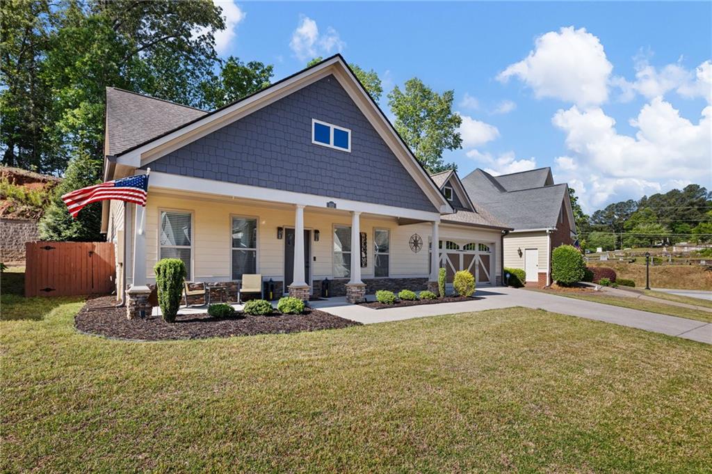 102 Kirk Drive Dallas, GA 30132 - Photo 26 of 28 a front view of house with yard and outdoor seating