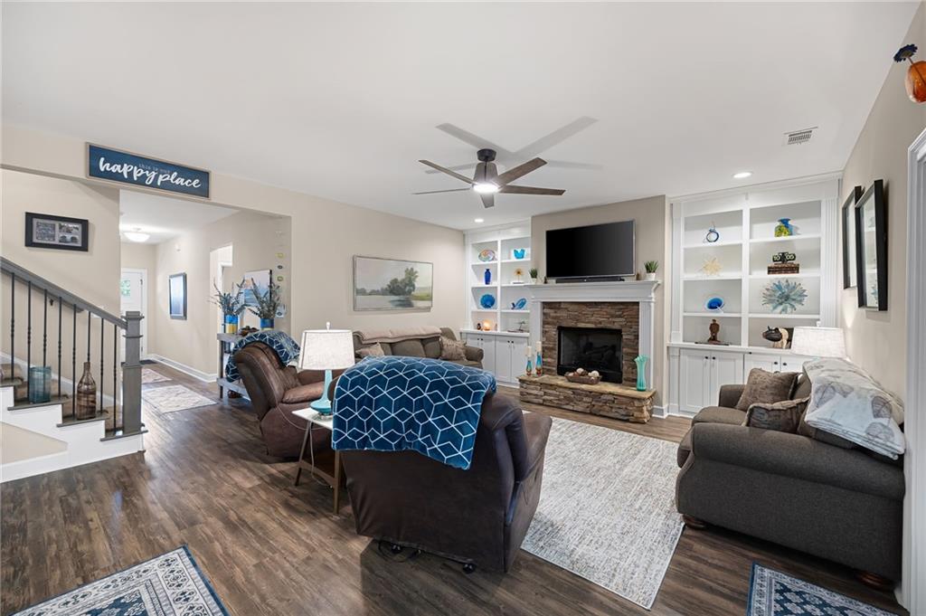 102 Kirk Drive Dallas, GA 30132 - Photo 6 of 28 a living room with furniture a flat screen tv and a fireplace