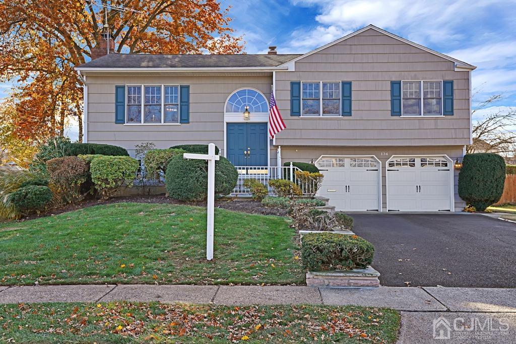 134 Benart Place Middlesex, NJ 08846 - Photo 2 of 28 a front view of a house with garden