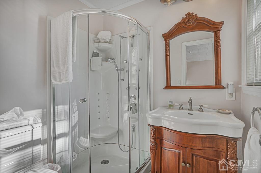 134 Benart Place Middlesex, NJ 08846 - Photo 14 of 28 a bathroom with a sink vanity and a mirror