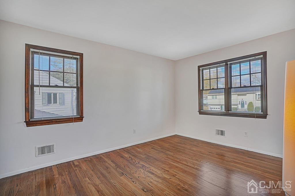 134 Benart Place Middlesex, NJ 08846 - Photo 15 of 28 a view of empty room with wooden floor and fan