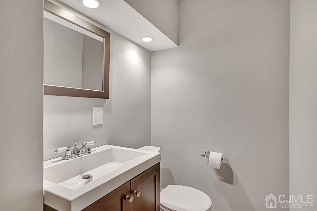 134 Benart Place Middlesex, NJ 08846 - Photo 22 of 28 a bathroom with a sink mirror and toilet