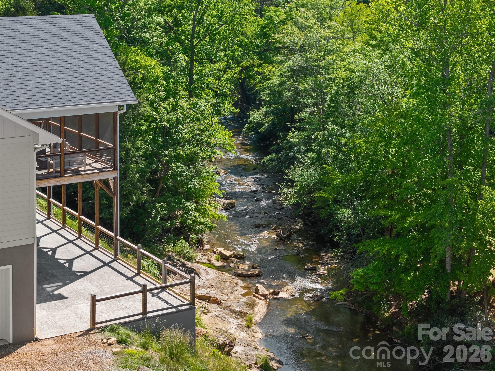 123 Israel Road Candler, NC 28715 - Photo 2 of 44 a backyard of a house with lots of green space