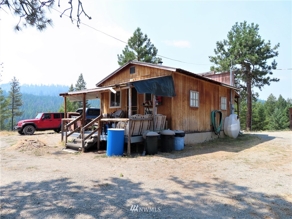 94 East Lilly Creek Road Republic, WA 99166 - Photo 12 of 20 a view of a house with a patio