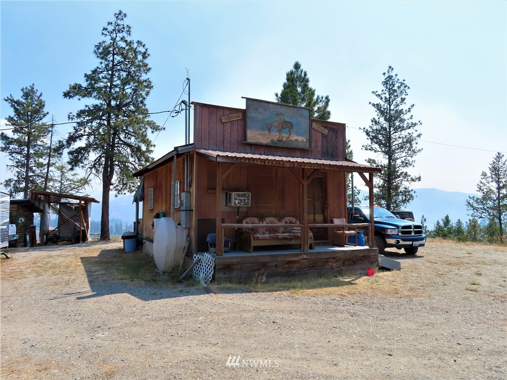 94 East Lilly Creek Road Republic, WA 99166 - Photo 13 of 20 a view of a building with a bench