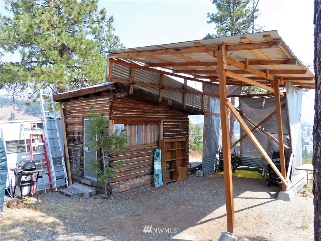 94 East Lilly Creek Road Republic, WA 99166 - Photo 6 of 20 a view of a house with a porch