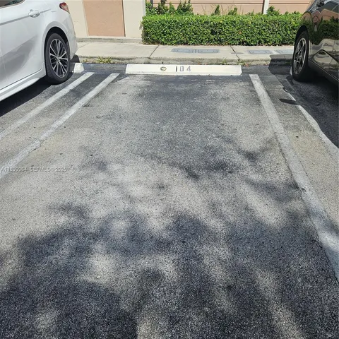 a view of a street with a yard