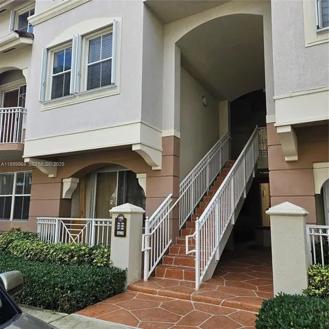 a view of front door of house with stairs