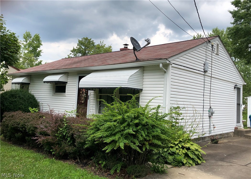 1081 Keefer Road Girard, OH 44420 - Photo 1 of 12 Larger than it Looks! Vinyl sided. Concrete Drive. 2++ car garage