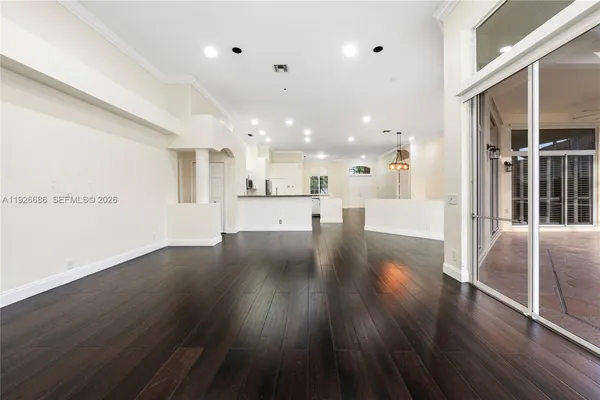 a view of kitchen with cabinets and wooden floor