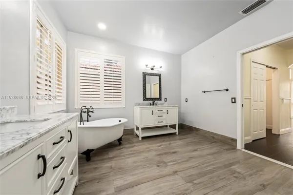 a view of gallery with wooden floor