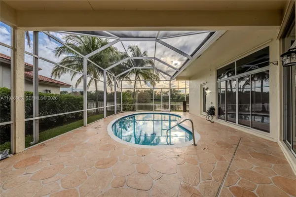 a view of a swimming pool with a patio