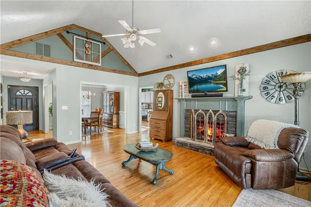 a open kitchen with stainless steel appliances granite countertop a stove and a refrigerator