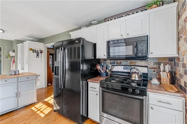 a view of a dining room with furniture and a window