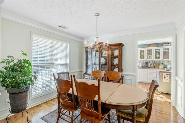a room with a chandelier furniture and a chandelier
