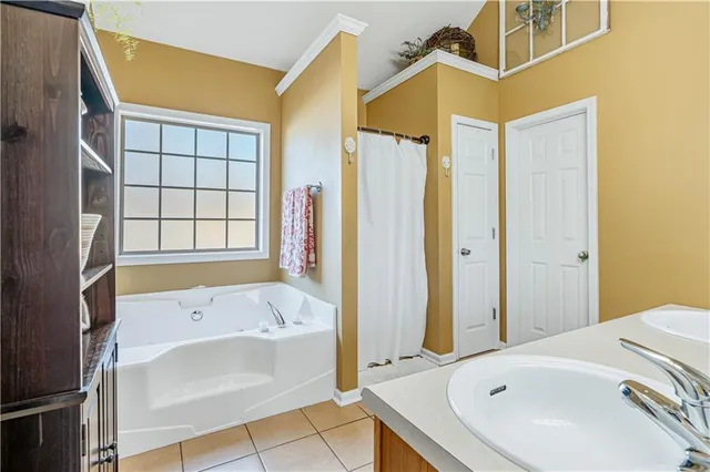 a view of a room with wooden floor stairs and a chandelier