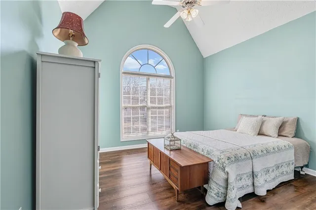a bathroom with a toilet a sink and a mirror