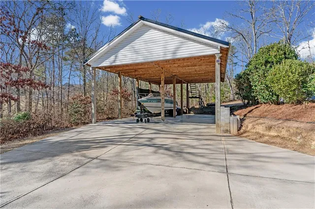 an aerial view of a house with garden space and sitting area
