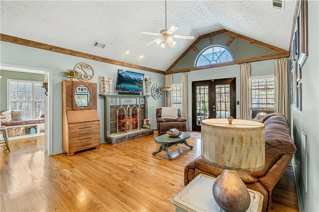 a living room with furniture and a fireplace