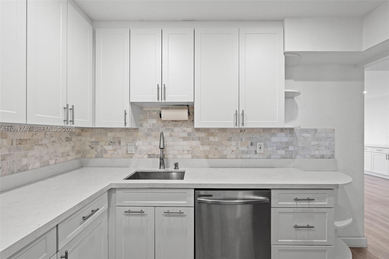 7765 Southwest 86th Street, Unit F2303 Miami, FL 33143 - Photo 15 of 50 a kitchen with a sink and cabinets