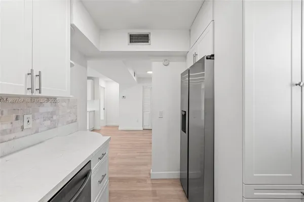 a bathroom with a sink a toilet and a window