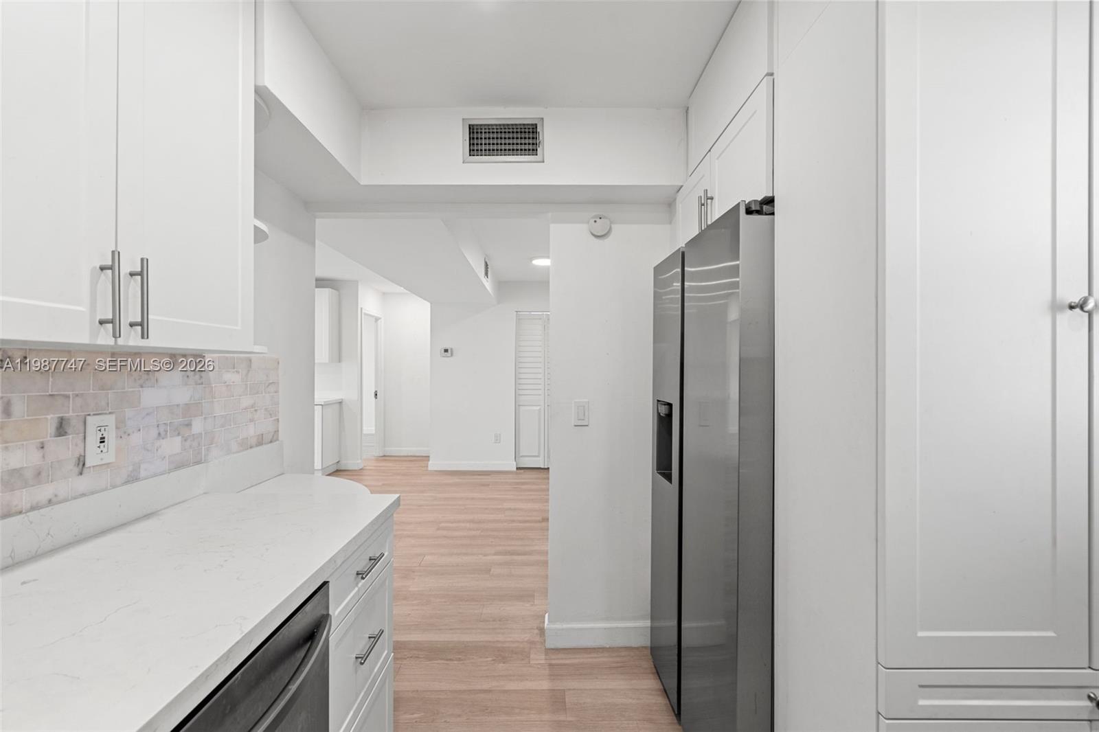 7765 Southwest 86th Street, Unit F2303 Miami, FL 33143 - Photo 16 of 50 a bathroom with a sink and a mirror