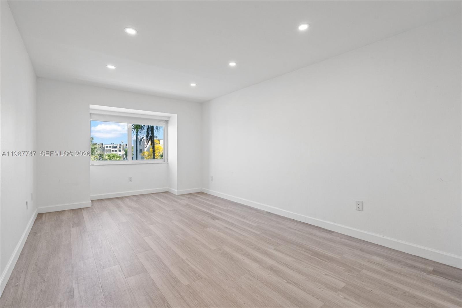 7765 Southwest 86th Street, Unit F2303 Miami, FL 33143 - Photo 17 of 50 a view of an empty room and a window