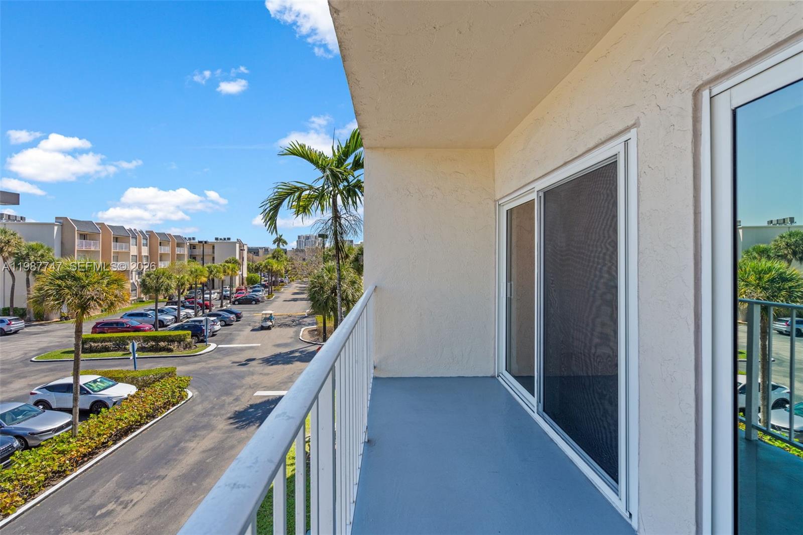 7765 Southwest 86th Street, Unit F2303 Miami, FL 33143 - Photo 34 of 50 a view of a balcony with chairs