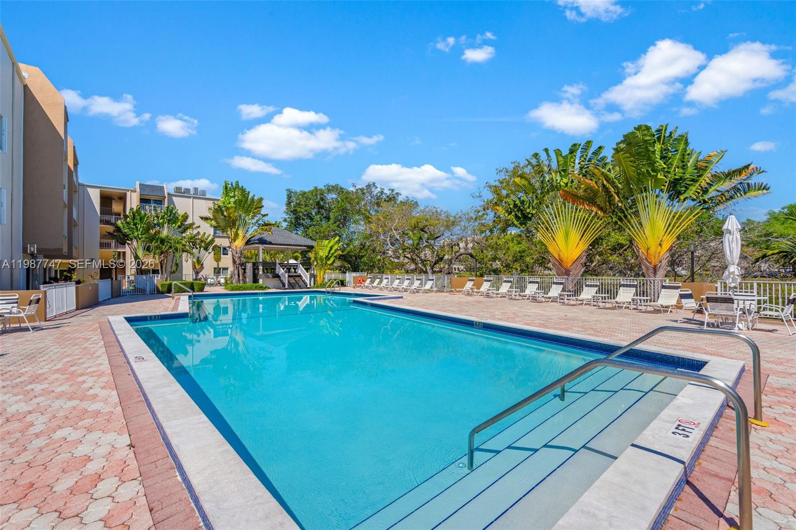 7765 Southwest 86th Street, Unit F2303 Miami, FL 33143 - Photo 38 of 50 a view of swimming pool with outdoor seating