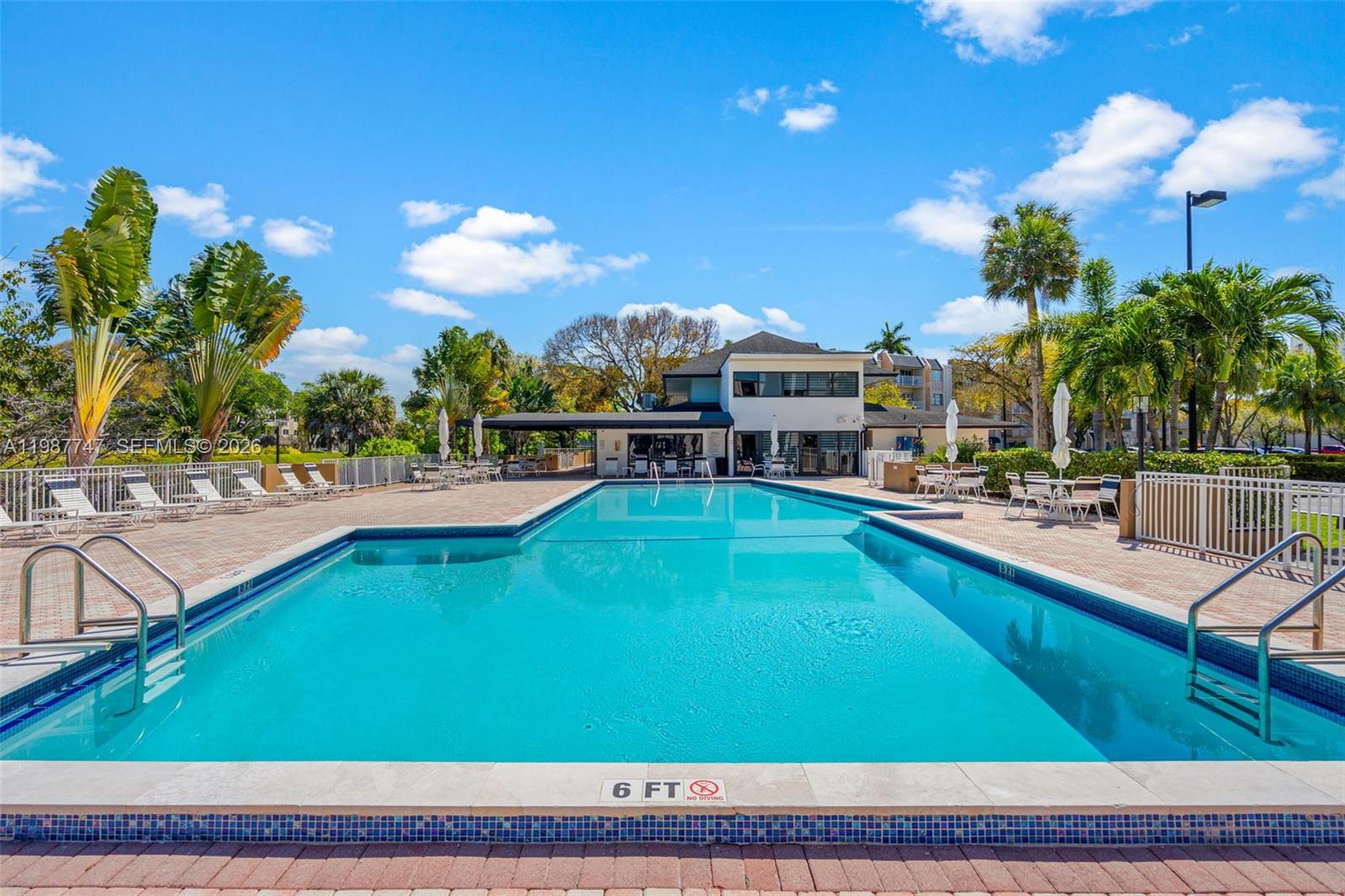 7765 Southwest 86th Street, Unit F2303 Miami, FL 33143 - Photo 39 of 50 a view of a swimming pool with outdoor seating
