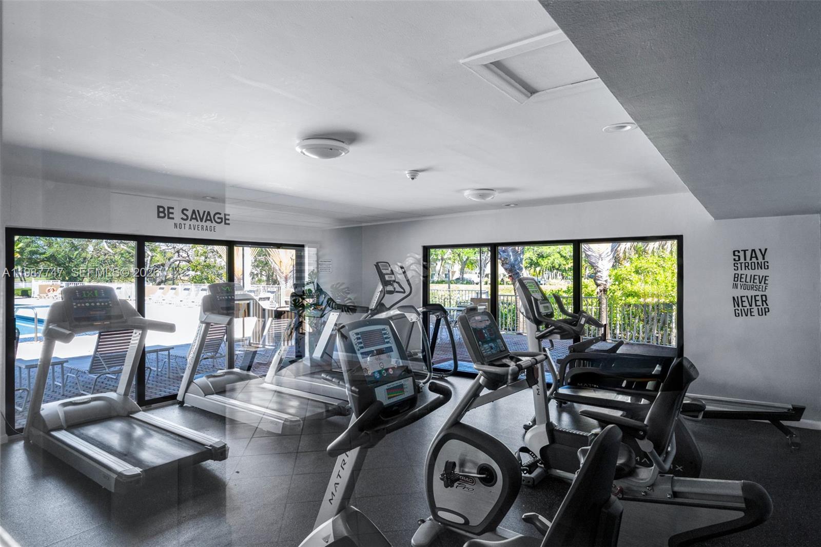 7765 Southwest 86th Street, Unit F2303 Miami, FL 33143 - Photo 40 of 50 a view of a room with gym equipment