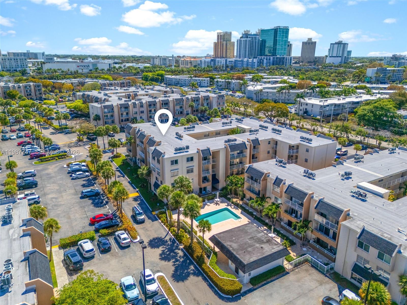 7765 Southwest 86th Street, Unit F2303 Miami, FL 33143 - Photo 45 of 50 a view of a city with tall buildings