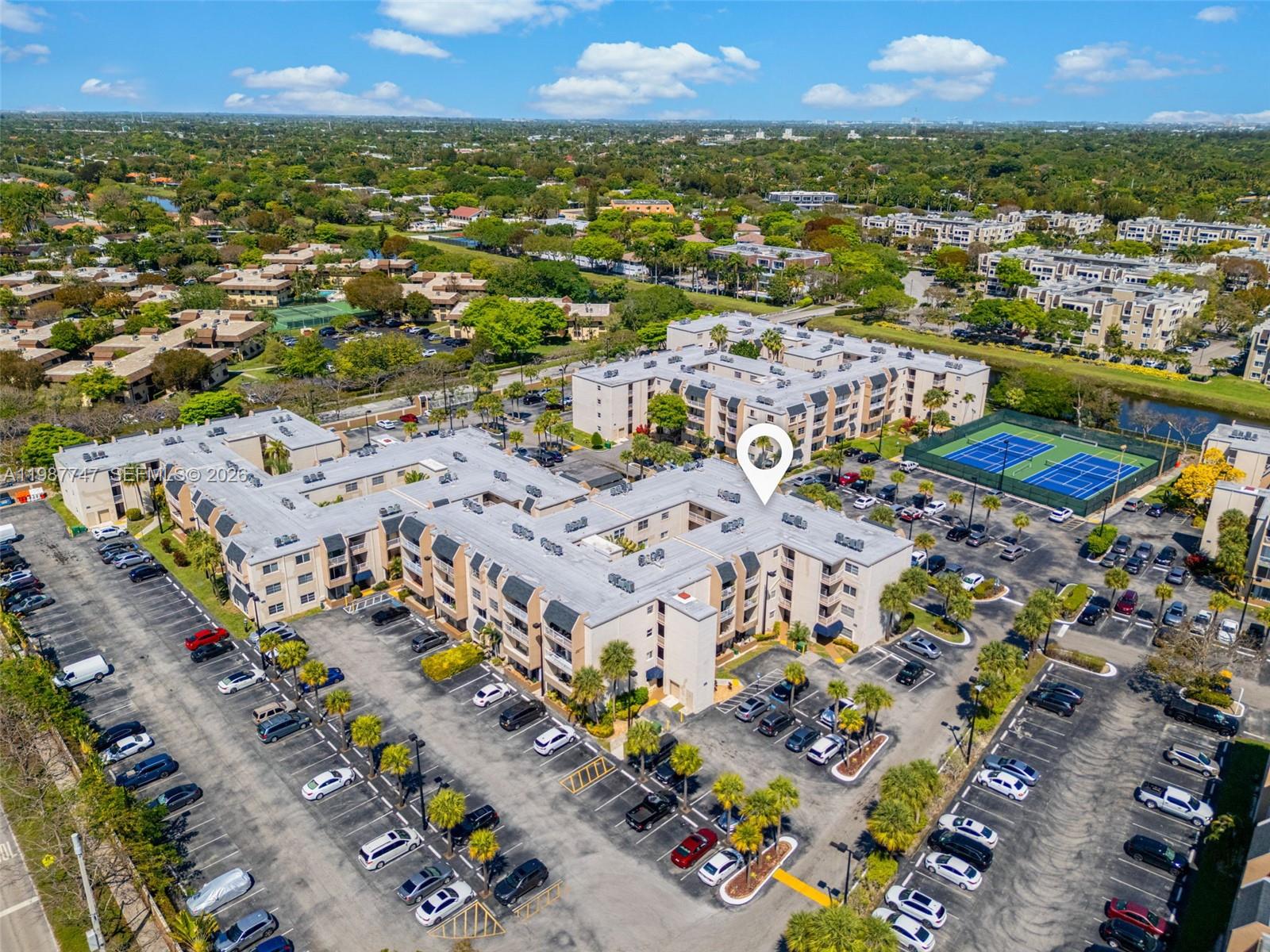 7765 Southwest 86th Street, Unit F2303 Miami, FL 33143 - Photo 46 of 50 an aerial view of residential houses with outdoor space