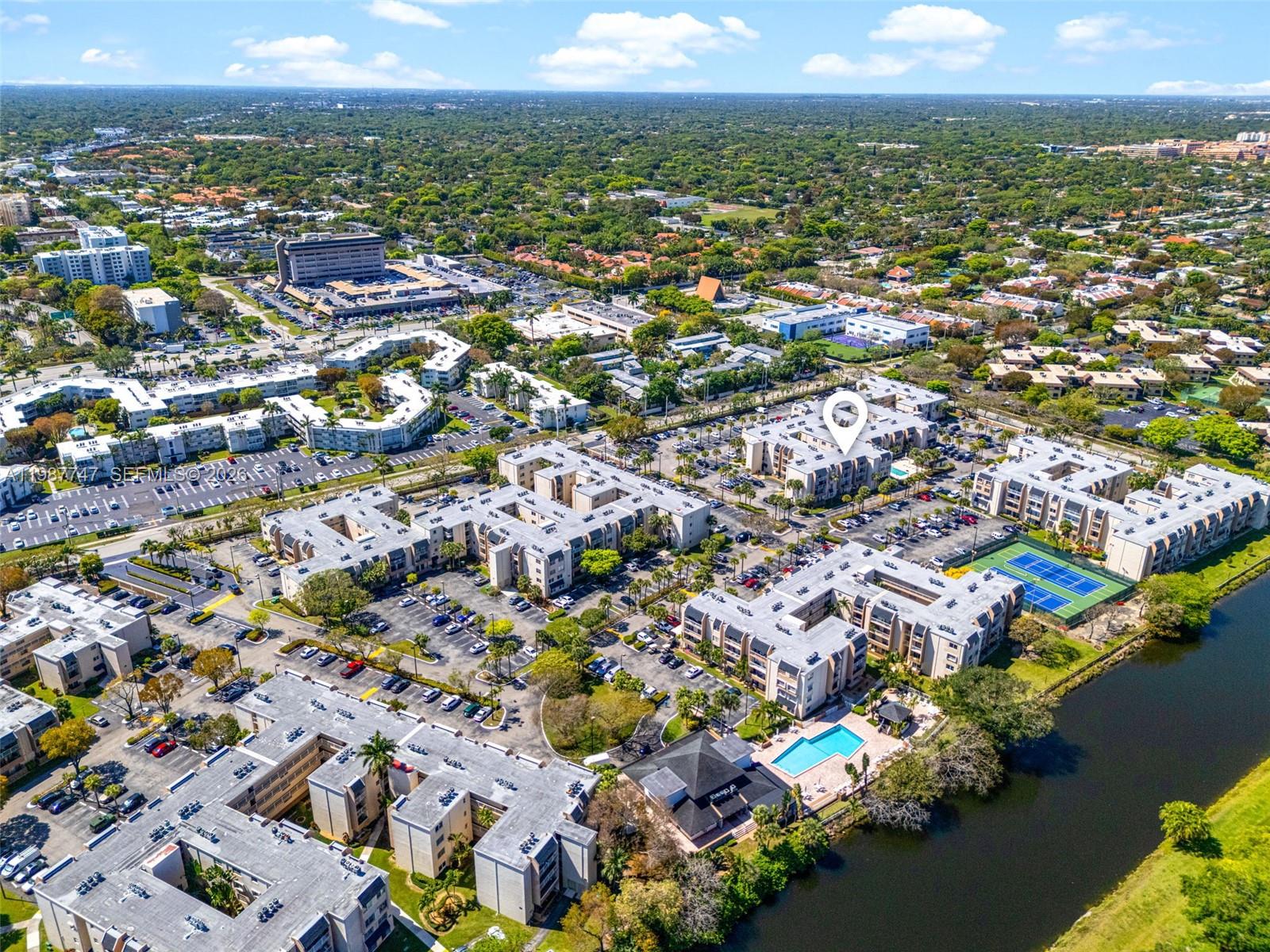 7765 Southwest 86th Street, Unit F2303 Miami, FL 33143 - Photo 47 of 50 an aerial view of residential houses with outdoor space