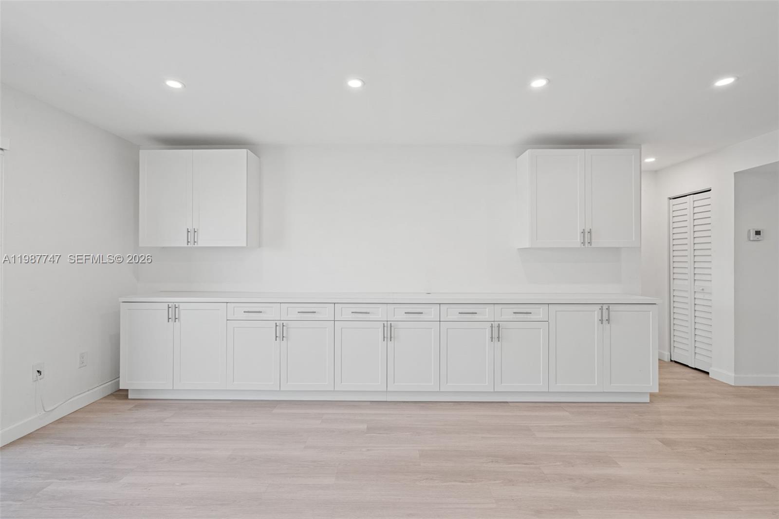 7765 Southwest 86th Street, Unit F2303 Miami, FL 33143 - Photo 5 of 50 a view of a kitchen with white cabinets