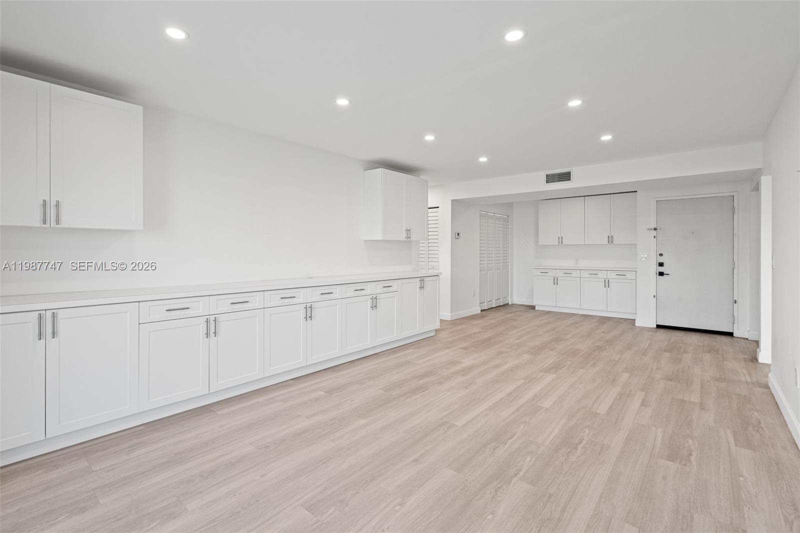 7765 Southwest 86th Street, Unit F2303 Miami, FL 33143 - Photo 6 of 50 a view of a kitchen with white cabinets