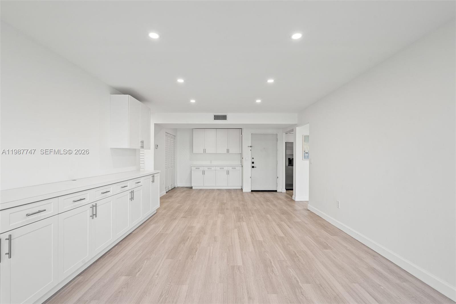 7765 Southwest 86th Street, Unit F2303 Miami, FL 33143 - Photo 7 of 50 a view of a kitchen with wooden floor