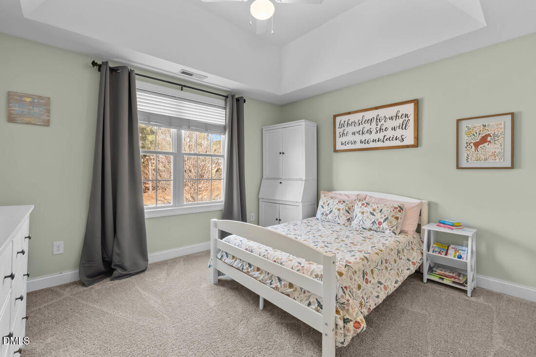170 Valley Pines Circle Spring Lake, NC 28390 - Photo 39 of 55 a bedroom with a bed painting and a window