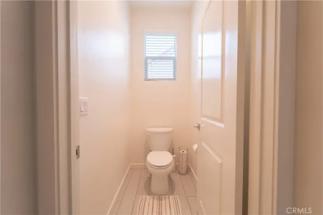 a bathroom with a toilet and a sink