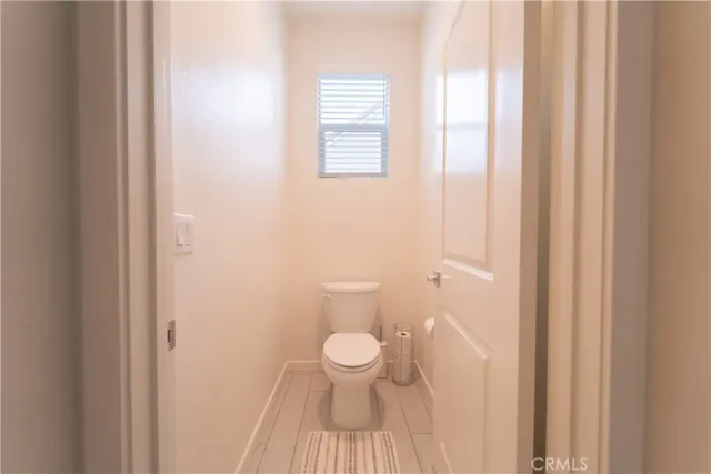 a bathroom with a toilet and a sink