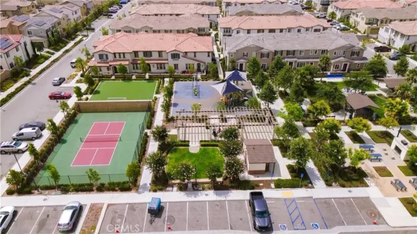 an aerial view of a house with a yard