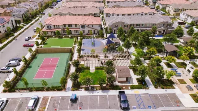 an aerial view of multiple houses with yard