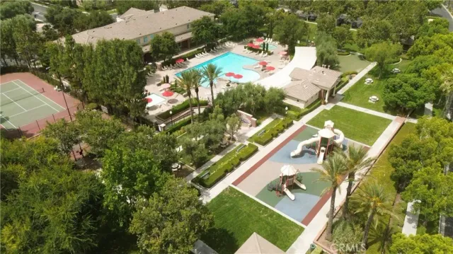 an aerial view of a house with a yard