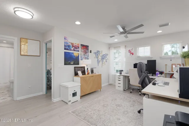 a view of a chairs and table in patio