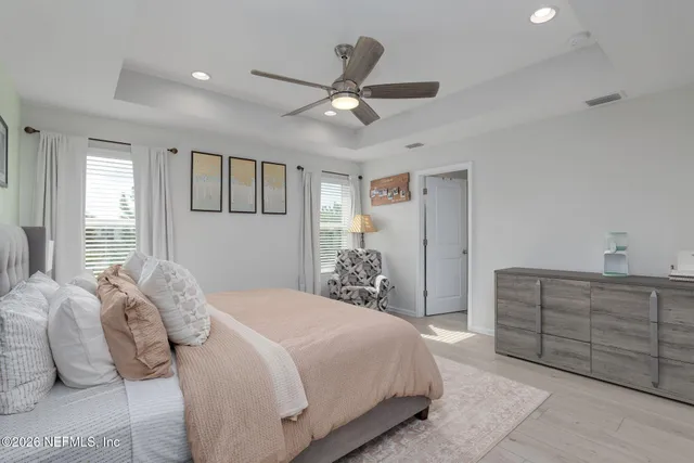 a dining room with a wooden floor and shelf