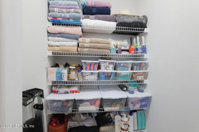 a bathroom with a glass shower door