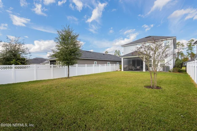 a view of walk in closet with clothes
