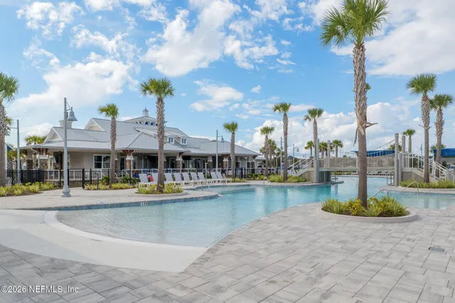 a view of swimming pool with lounge chair