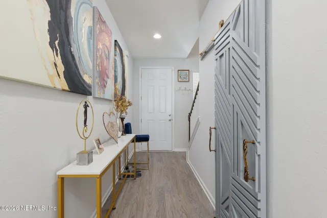 a view of a livingroom with furniture and stairs
